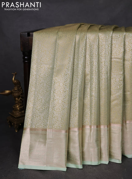 Semi kanchipuram tissue silk saree pista green with allover silver zari woven brocade weaves and zari woven border