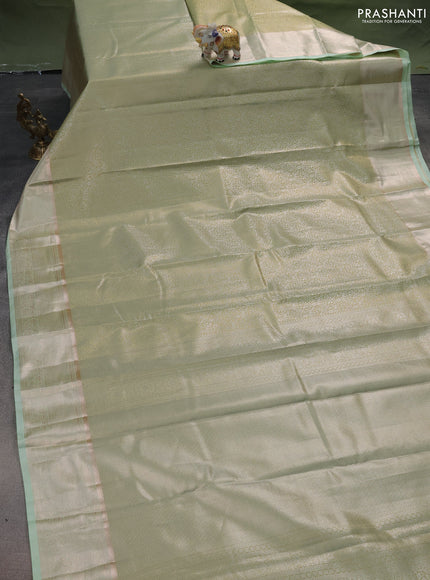 Semi kanchipuram tissue silk saree pista green with allover silver zari woven brocade weaves and zari woven border