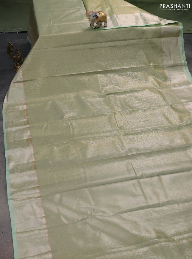 Semi kanchipuram tissue silk saree pista green with allover silver zari woven brocade weaves and zari woven border