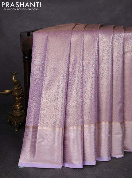 Semi kanchipuram tissue silk saree mild lavender with allover silver zari woven brocade weaves and zari woven border