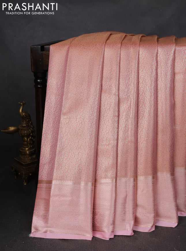 Semi kanchipuram tissue silk saree dual shade of peach and mild peach pink with allover silver zari woven brocade weaves and zari woven border