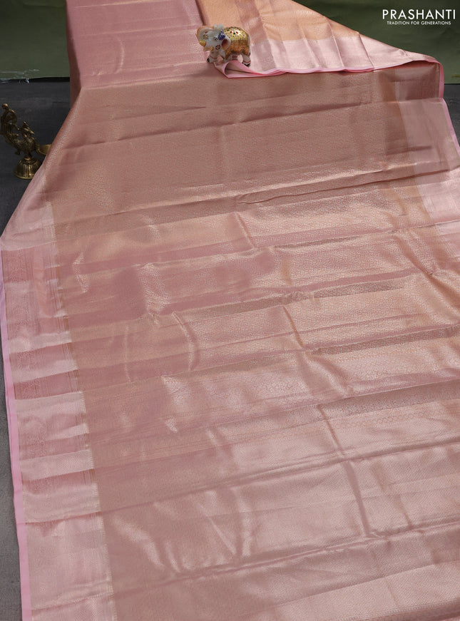 Semi kanchipuram tissue silk saree dual shade of peach and mild peach pink with allover silver zari woven brocade weaves and zari woven border