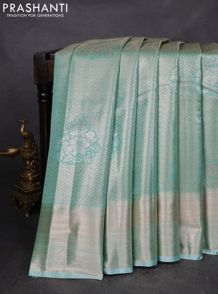 Semi kanchipuram tissue silk saree teal blue with allover silver zari woven brocade weaves and zari woven border