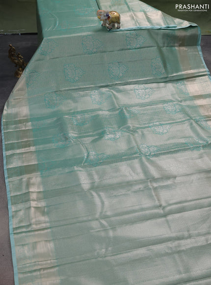 Semi kanchipuram tissue silk saree teal blue with allover silver zari woven brocade weaves and zari woven border