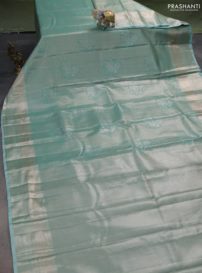 Semi kanchipuram tissue silk saree teal blue with allover silver zari woven brocade weaves and zari woven border