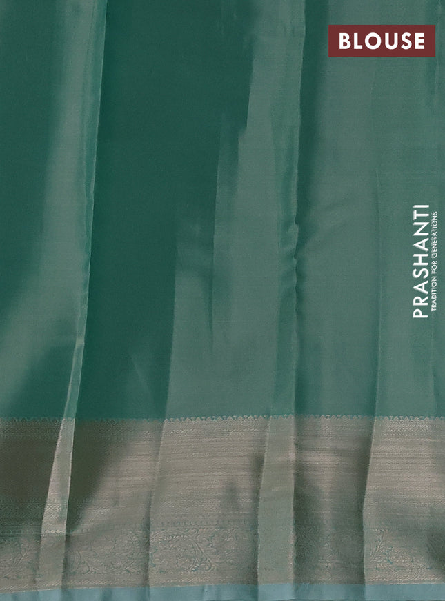 Semi kanchipuram tissue silk saree teal blue with allover silver zari woven brocade weaves and zari woven border