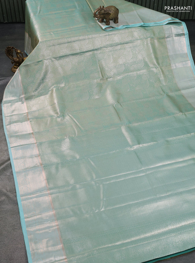 Semi kanchipuram tissue silk saree teal blue with allover silver zari woven brocade weaves and zari woven border