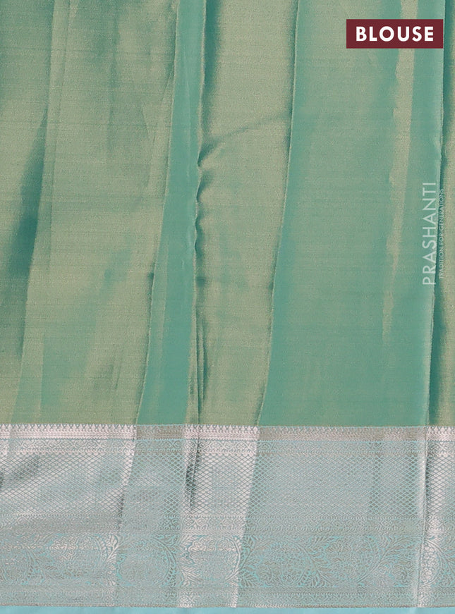 Semi kanchipuram tissue silk saree teal blue with allover silver zari woven brocade weaves and zari woven border