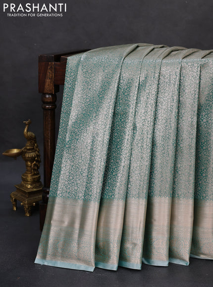Semi kanchipuram tissue silk saree teal shade with allover silver zari woven brocade weaves and zari woven border