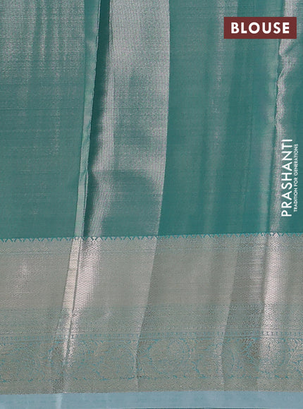 Semi kanchipuram tissue silk saree teal shade with allover silver zari woven brocade weaves and zari woven border