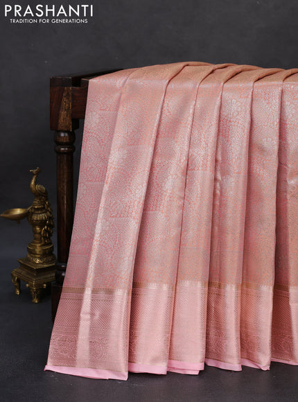 Semi kanchipuram tissue silk saree peach orange and peach pink with allover silver zari woven brocade weaves and zari woven border