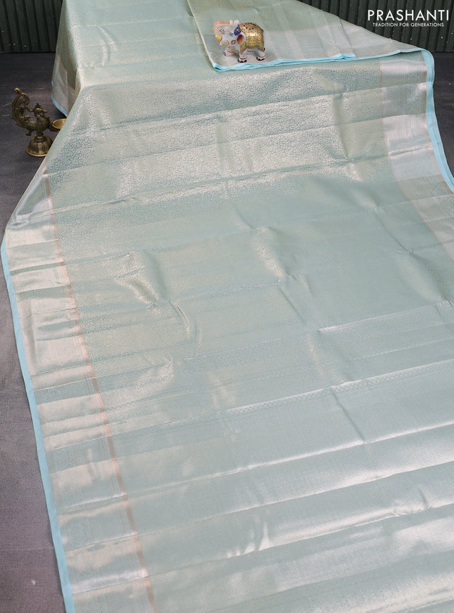 Semi kanchipuram tissue silk saree dual shade of teal with allover silver zari woven brocade weaves and zari woven border