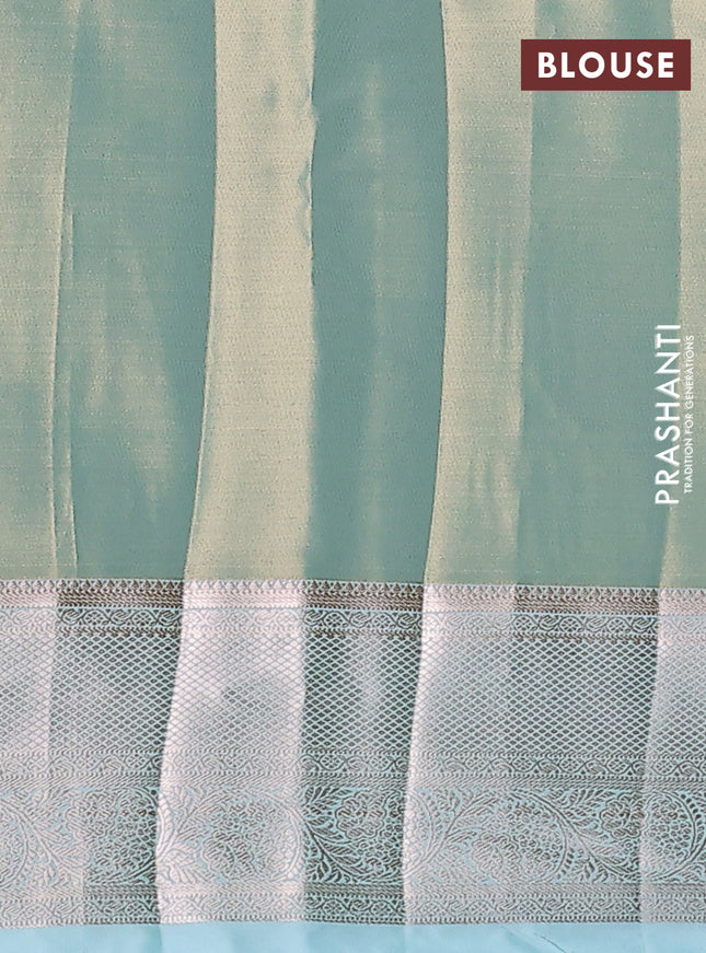 Semi kanchipuram tissue silk saree dual shade of teal with allover silver zari woven brocade weaves and zari woven border