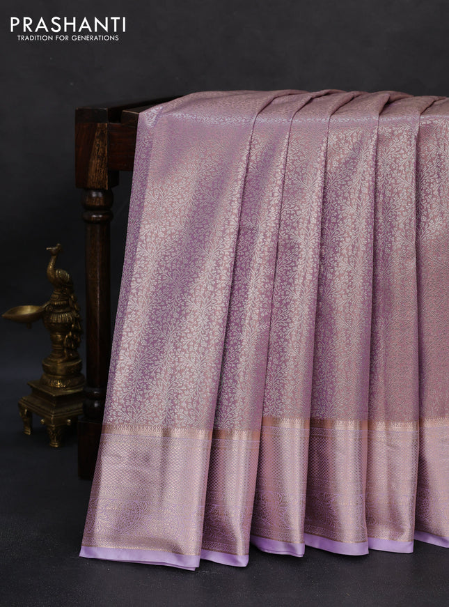 Semi kanchipuram tissue silk saree lavender with allover silver zari woven brocade weaves and zari woven border