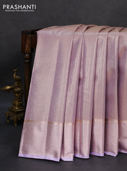 Semi kanchipuram tissue silk saree mild lavender with allover silver zari woven brocade weaves and zari woven border