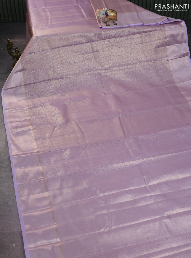Semi kanchipuram tissue silk saree mild lavender with allover silver zari woven brocade weaves and zari woven border