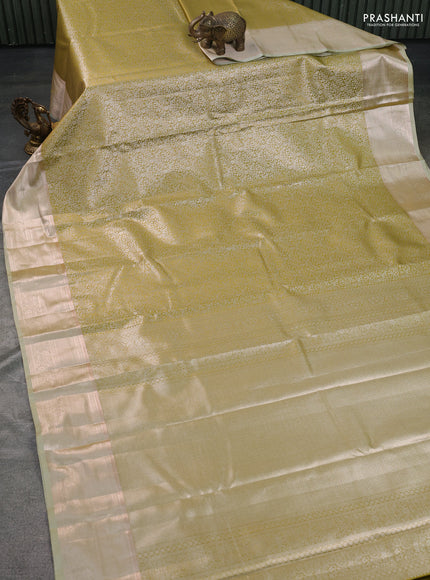 Semi kanchipuram tissue silk saree lime yellow with allover silver zari woven brocade weaves and zari woven border