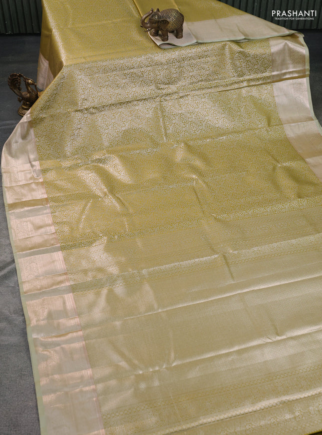 Semi kanchipuram tissue silk saree lime yellow with allover silver zari woven brocade weaves and zari woven border