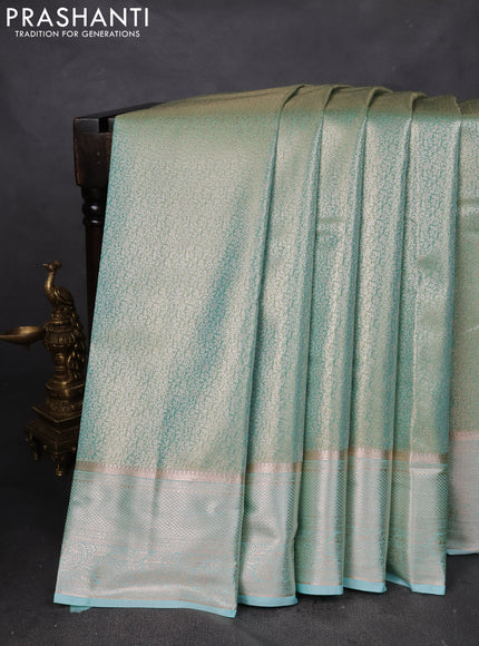 Semi kanchipuram tissue silk saree teal with allover silver zari woven brocade weaves and zari woven border
