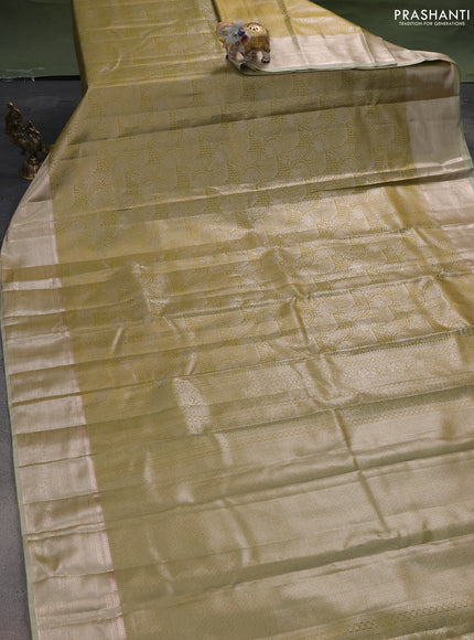 Semi kanchipuram tissue silk saree lime green with allover silver zari woven brocade weaves and zari woven border
