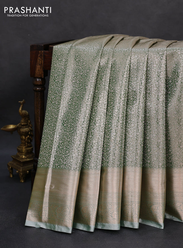 Semi kanchipuram tissue silk saree green shade with allover silver zari woven brocade weaves and zari woven border