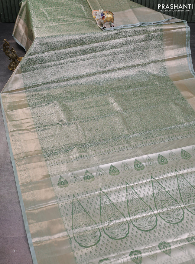 Semi kanchipuram tissue silk saree green shade with allover silver zari woven brocade weaves and zari woven border