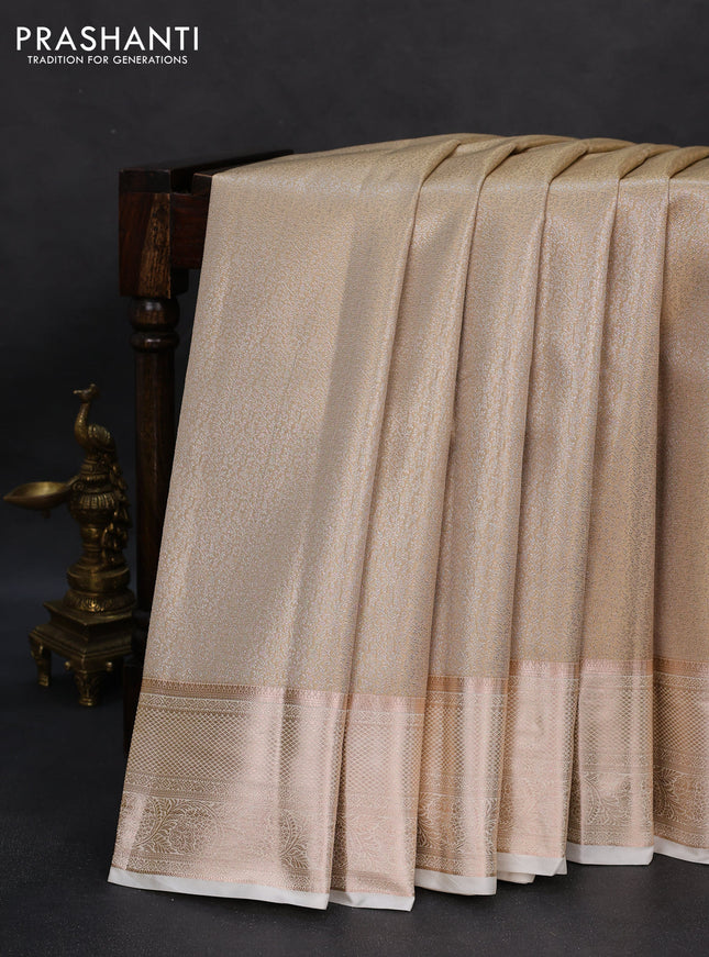 Semi kanchipuram tissue silk saree cream with allover silver zari woven brocade weaves and zari woven border
