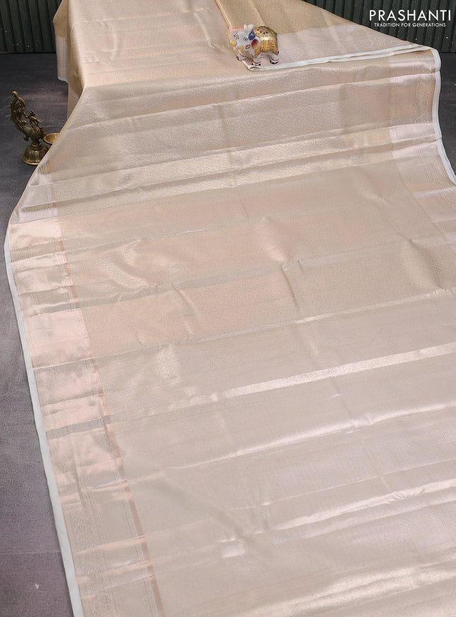 Semi kanchipuram tissue silk saree cream with allover silver zari woven brocade weaves and zari woven border