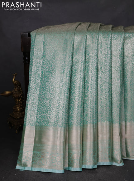 Semi kanchipuram tissue silk saree teal shade with allover silver zari woven brocade weaves and zari woven border
