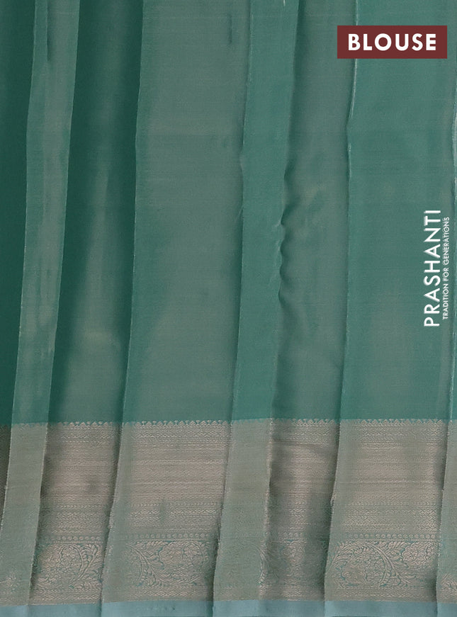 Semi kanchipuram tissue silk saree teal shade with allover silver zari woven brocade weaves and zari woven border