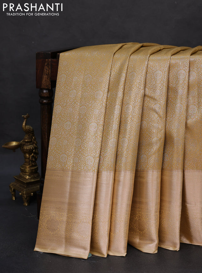 Semi kanchipuram tissue silk saree sandal with allover silver zari woven brocade weaves and long zari woven border