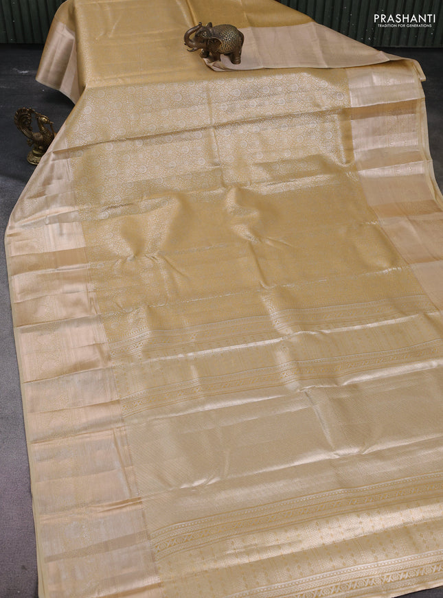 Semi kanchipuram tissue silk saree sandal with allover silver zari woven brocade weaves and long zari woven border