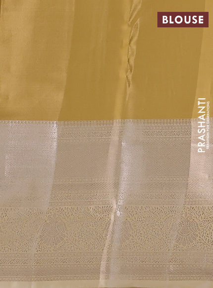 Semi kanchipuram tissue silk saree sandal with allover silver zari woven brocade weaves and long zari woven border