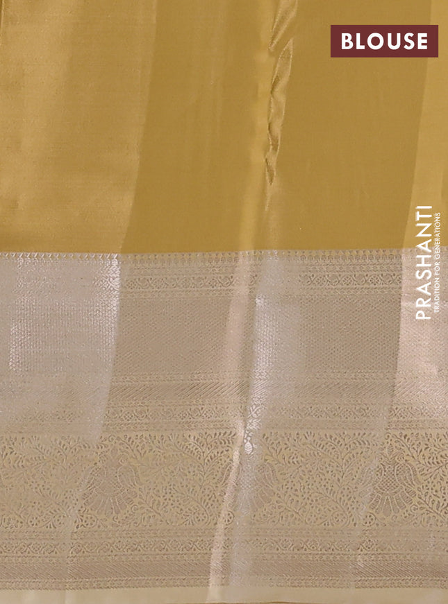 Semi kanchipuram tissue silk saree sandal with allover silver zari woven brocade weaves and long zari woven border