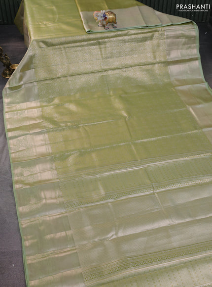Semi kanchipuram tissue silk saree pista green with allover silver zari woven brocade weaves and long zari woven border