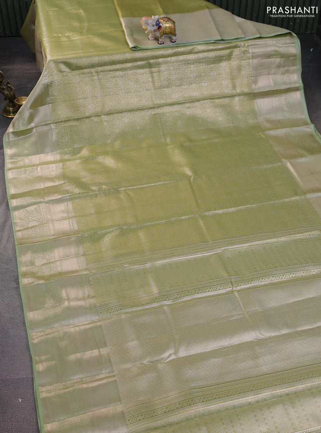 Semi kanchipuram tissue silk saree pista green with allover silver zari woven brocade weaves and long zari woven border