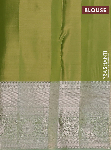 Semi kanchipuram tissue silk saree pista green with allover silver zari woven brocade weaves and long zari woven border