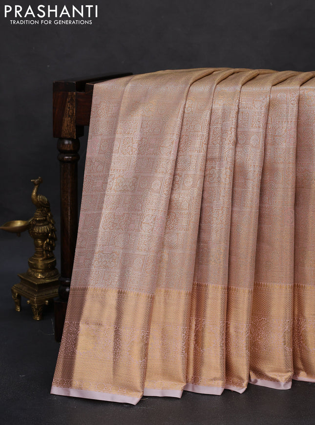 Semi kanchipuram tissue silk saree pastel peach with allover silver zari woven brocade weaves and zari woven border