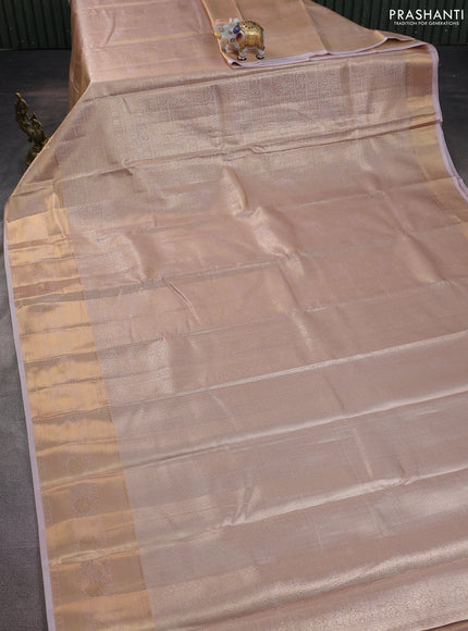 Semi kanchipuram tissue silk saree pastel peach with allover silver zari woven brocade weaves and zari woven border