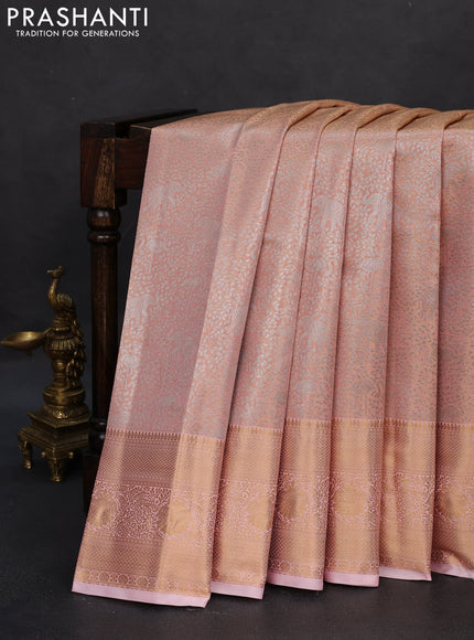 Semi kanchipuram tissue silk saree peach orange with allover silver zari woven brocade weaves and zari woven border