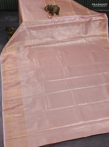 Semi kanchipuram tissue silk saree peach orange with allover silver zari woven brocade weaves and zari woven border