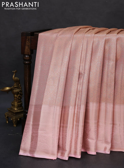 Semi kanchipuram tissue silk saree mild peach with allover silver zari woven brocade weaves and long zari woven border