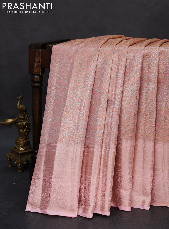 Semi kanchipuram tissue silk saree mild peach with allover silver zari woven brocade weaves and long zari woven border