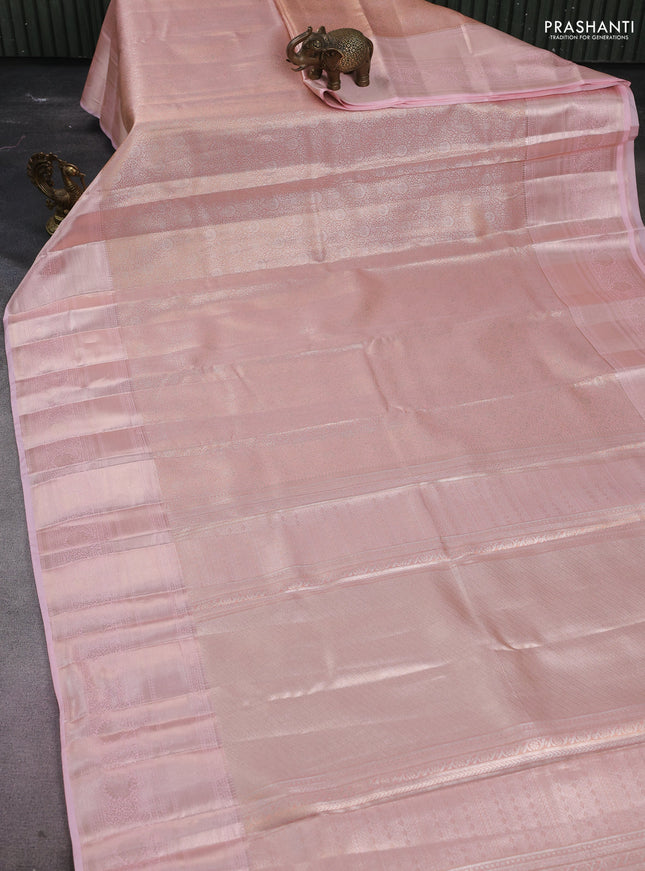 Semi kanchipuram tissue silk saree mild peach with allover silver zari woven brocade weaves and long zari woven border