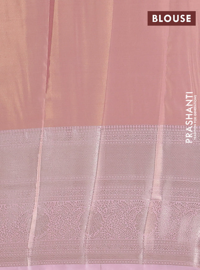 Semi kanchipuram tissue silk saree mild peach with allover silver zari woven brocade weaves and long zari woven border