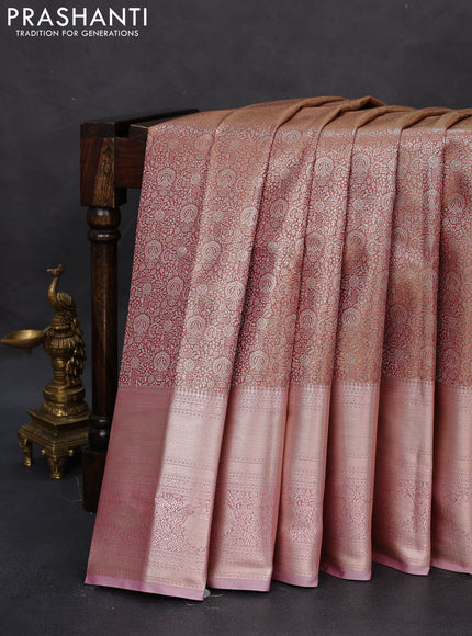 Semi kanchipuram tissue silk saree dual shade of pinkish gold and pastel pink with allover silver zari woven brocade weaves and long zari woven border