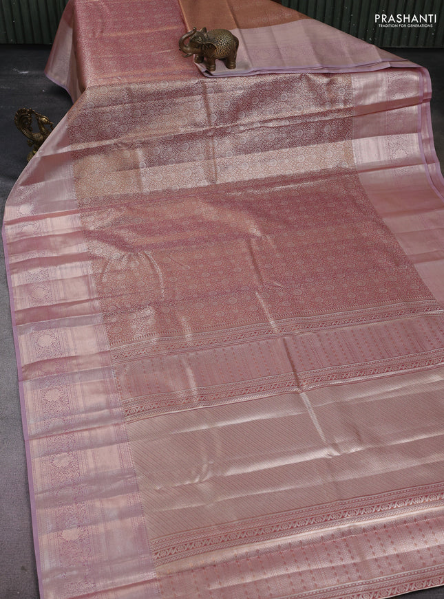 Semi kanchipuram tissue silk saree dual shade of pinkish gold and pastel pink with allover silver zari woven brocade weaves and long zari woven border