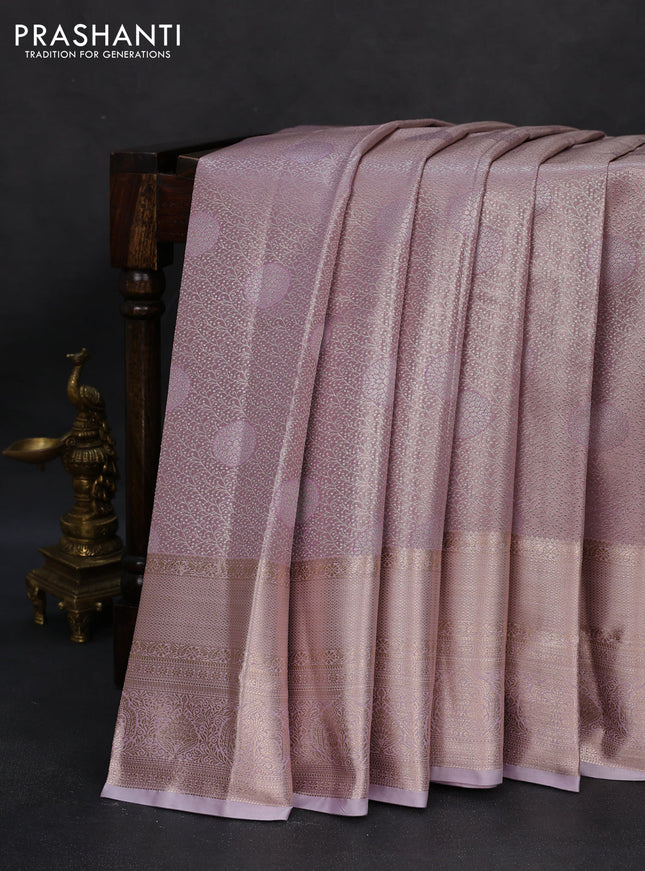 Semi kanchipuram tissue silk saree mild lavender with allover silver zari woven brocade weaves and long zari woven border