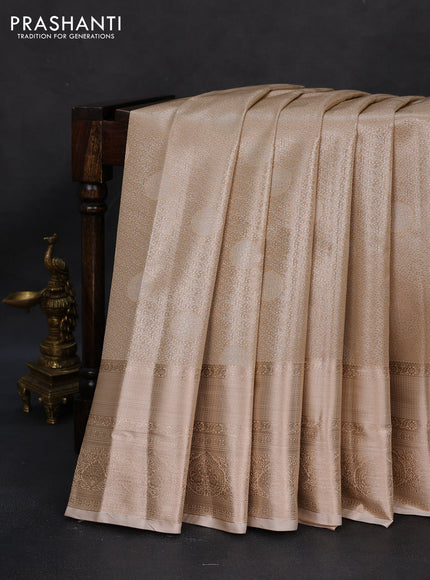 Semi kanchipuram tissue silk saree sandal with allover silver zari woven brocade weaves and long zari woven border