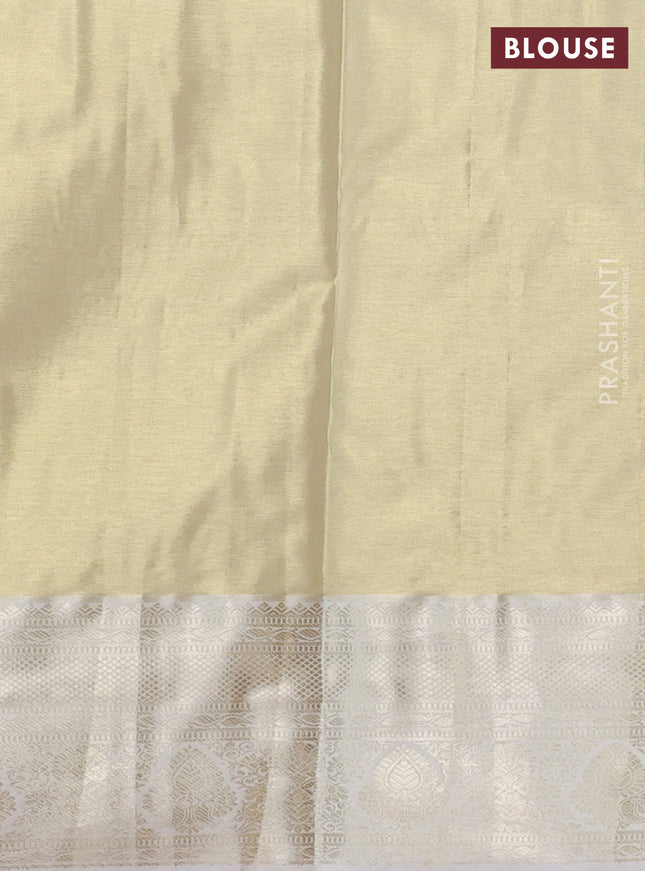 Semi kanchipuram tissue silk saree cream with allover silver zari woven brocade weaves and zari woven border